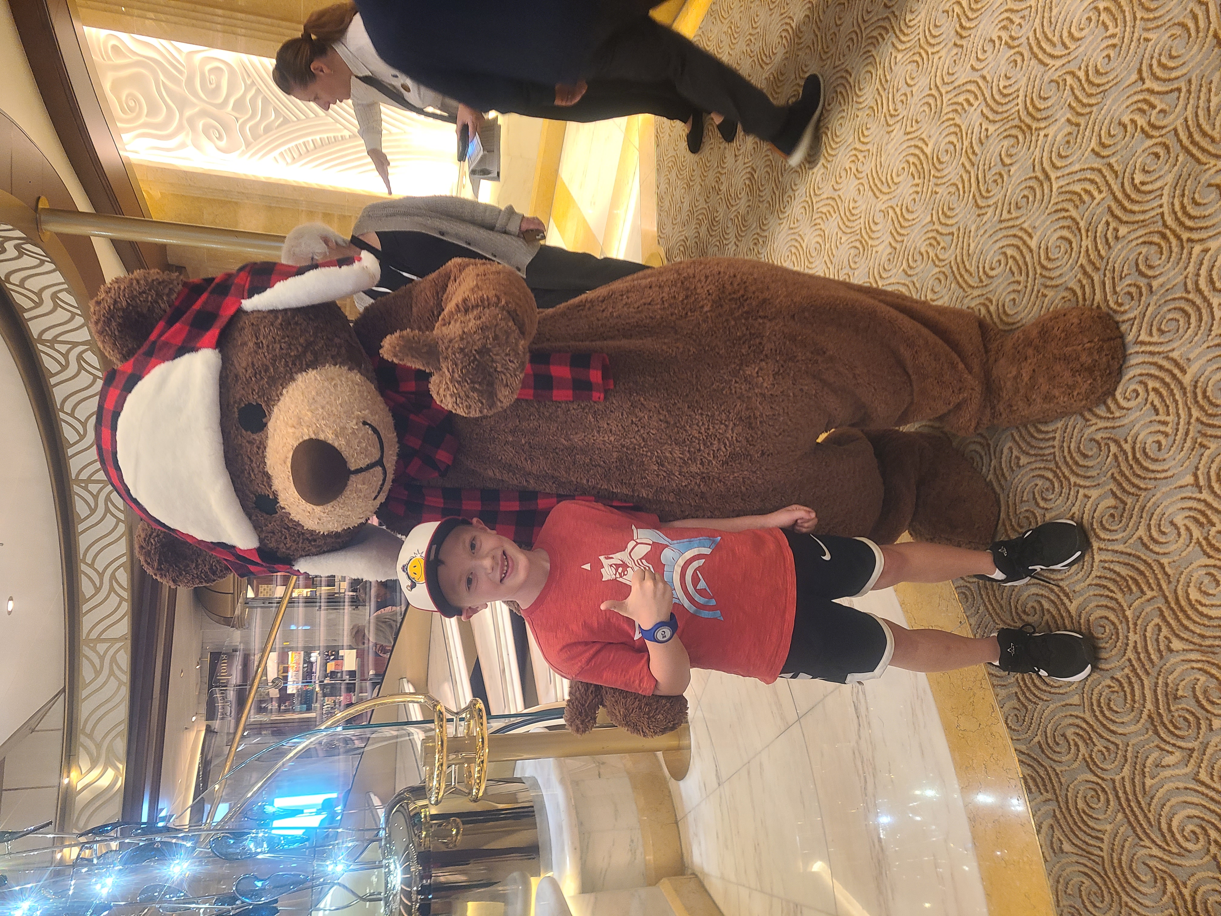Connor with the bear mascot giving the thumbs up